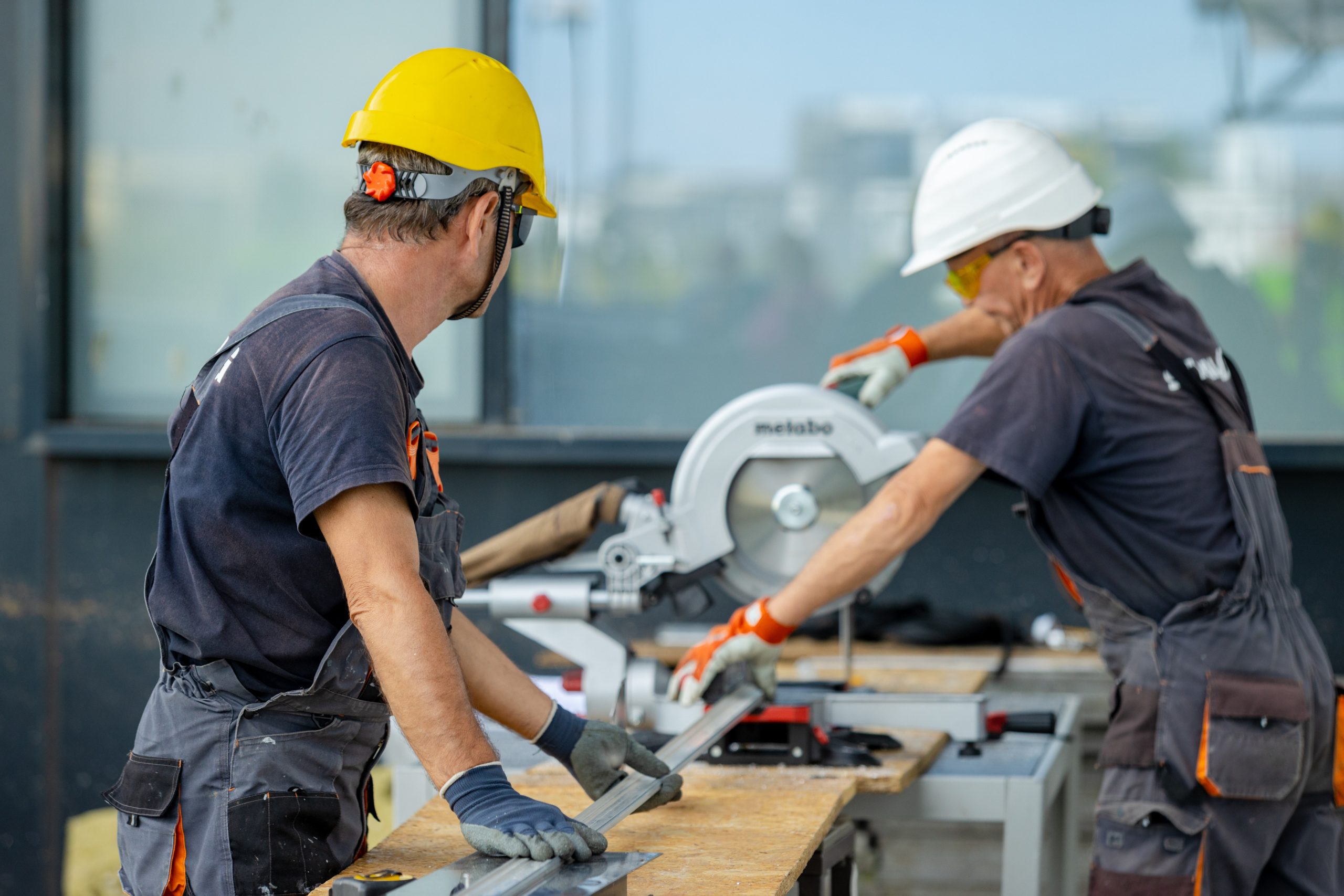 Tradies working cutting steel